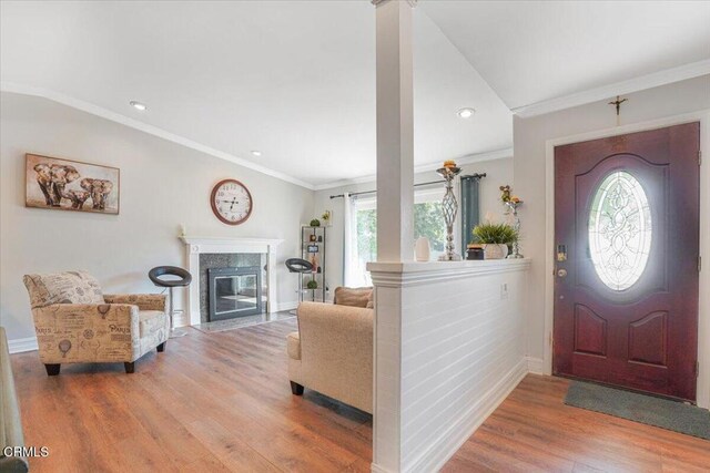 429 Walter Ave, Newbury Park, CA 91320 - entrance foyer with wood finished floors, a high end fireplace, crown molding, and recessed lighting