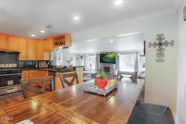 429 Walter Ave, Newbury Park, CA 91320 - dining area with recessed lighting, a fireplace, and ornamental molding