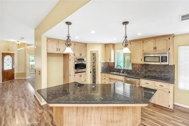 9425 Oak Hills Ave, Bakersfield, CA 93312 - kitchen with stainless steel appliances, light brown cabinetry, light wood-style floors, and recessed lighting