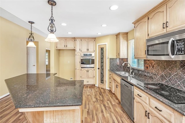 9425 Oak Hills Ave, Bakersfield, CA 93312 - kitchen with stainless steel appliances, light brown cabinetry, light wood-type flooring, recessed lighting, and dark stone counters