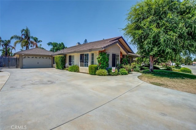 9425 Oak Hills Ave, Bakersfield, CA 93312 - single story home with a garage, stucco siding, concrete driveway, and a tiled roof