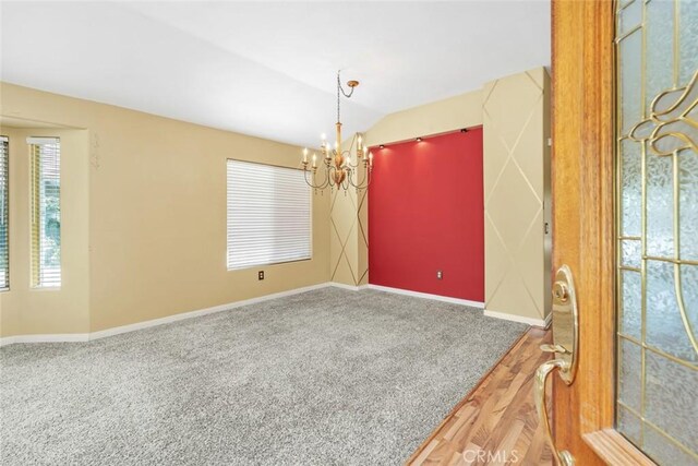 9425 Oak Hills Ave, Bakersfield, CA 93312 - empty room with a chandelier, vaulted ceiling, and carpet flooring