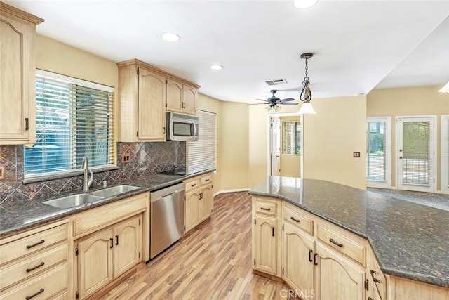 9425 Oak Hills Ave, Bakersfield, CA 93312 - kitchen featuring stainless steel appliances, light wood-style flooring, light brown cabinetry, and recessed lighting