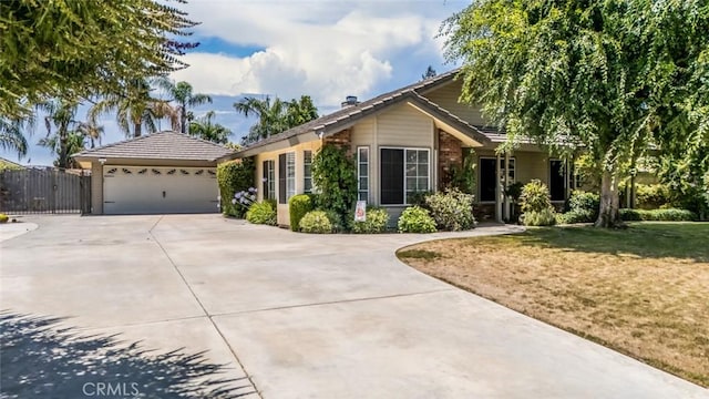 9425 Oak Hills Ave, Bakersfield, CA 93312 - single story home with concrete driveway, a garage, and brick siding