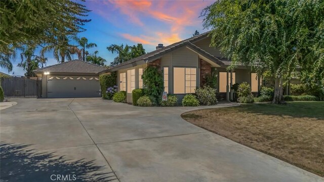 9425 Oak Hills Ave, Bakersfield, CA 93312 - ranch-style home with concrete driveway and a chimney