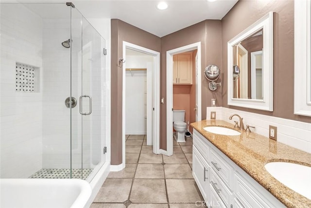 9425 Oak Hills Ave, Bakersfield, CA 93312 - full bath featuring a stall shower, tile patterned flooring, double vanity, and a spacious closet