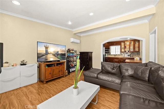 13162 Oaks Ave, Chino, CA 91710 - living area featuring ornamental molding, arched walkways, light wood-style flooring, a wall mounted air conditioner, and recessed lighting