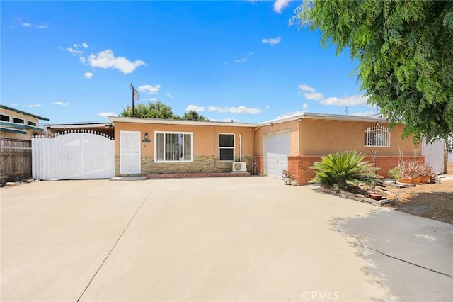 13162 Oaks Ave, Chino, CA 91710 - single story home featuring stucco siding, an attached garage, a gate, and stone siding