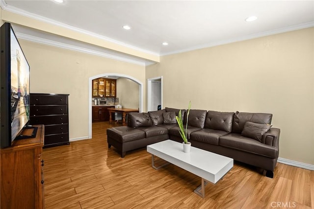 13162 Oaks Ave, Chino, CA 91710 - living area featuring arched walkways, wood finished floors, ornamental molding, and recessed lighting