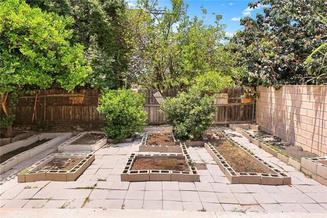 13162 Oaks Ave, Chino, CA 91710 - fenced backyard with a vegetable garden
