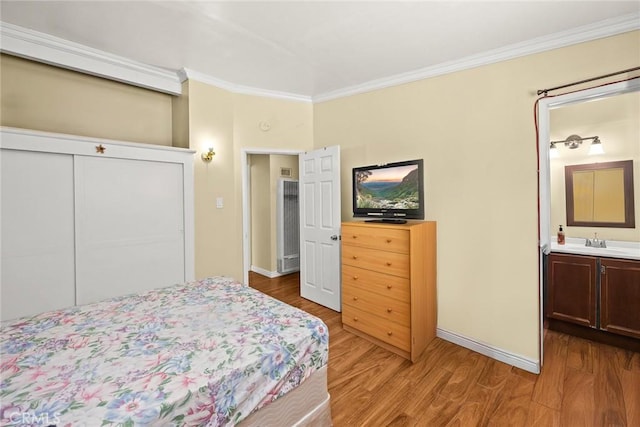 13162 Oaks Ave, Chino, CA 91710 - bedroom featuring ornamental molding, light wood finished floors, a closet, and ensuite bathroom