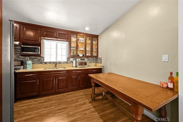 13162 Oaks Ave, Chino, CA 91710 - kitchen featuring stainless steel microwave, tasteful backsplash, light wood finished floors, glass insert cabinets, and recessed lighting