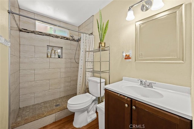13162 Oaks Ave, Chino, CA 91710 - full bath with vanity, a tile shower, and wood finished floors