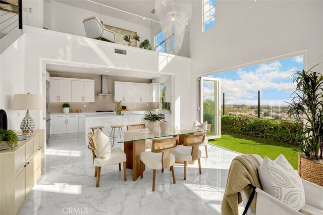 100 Soaring Eagle, Irvine, CA 92618 - dining area with light marble finish floors and a towering ceiling