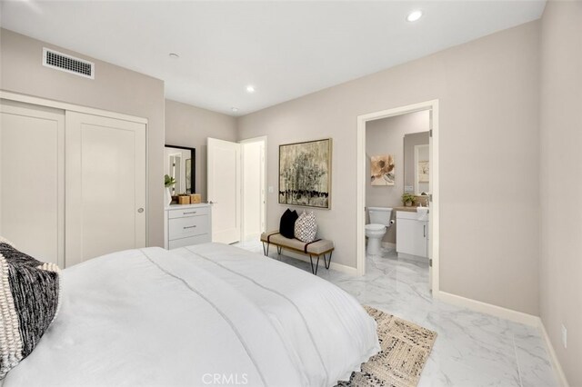 100 Soaring Eagle, Irvine, CA 92618 - bedroom featuring light marble finish floors, a closet, recessed lighting, and ensuite bath