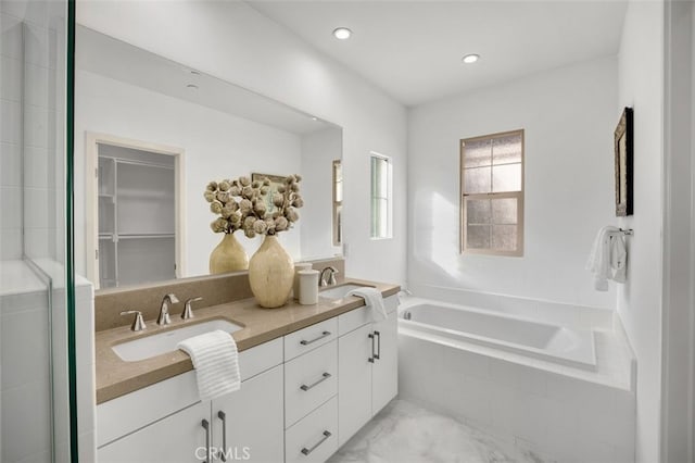 100 Soaring Eagle, Irvine, CA 92618 - full bathroom featuring double vanity, a garden tub, an enclosed shower, and recessed lighting