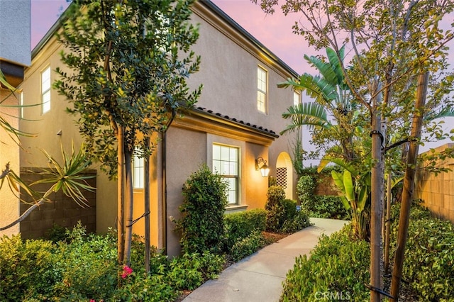 100 Soaring Eagle, Irvine, CA 92618 - property exterior at dusk with stucco siding