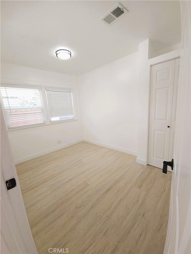 215 N Olive St, Anaheim, CA 92805 - unfurnished room with light wood-style floors and baseboards