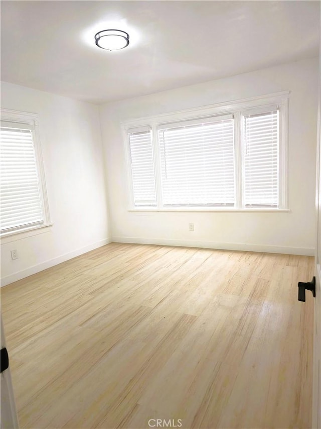 215 N Olive St, Anaheim, CA 92805 - empty room featuring wood finished floors and baseboards