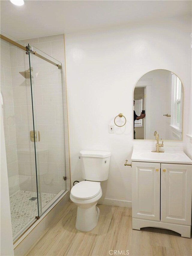 215 N Olive St, Anaheim, CA 92805 - full bathroom with wood finished floors, a stall shower, and vanity