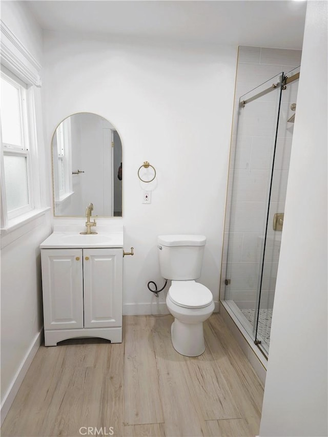 215 N Olive St, Anaheim, CA 92805 - bathroom with vanity, wood finished floors, and a shower stall