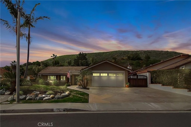3163 Inclinado, San Clemente, CA 92673 - ranch-style house with a garage, concrete driveway, and a mountain view