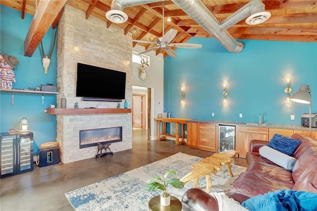 3163 Inclinado, San Clemente, CA 92673 - living room with beverage cooler, a wooden ceiling with exposed beams, a stone fireplace, ceiling fan, and high vaulted ceiling