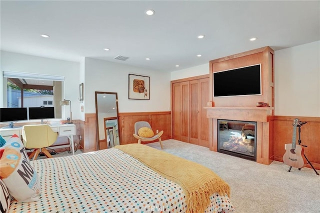 3163 Inclinado, San Clemente, CA 92673 - carpeted bedroom with a wainscoted wall, recessed lighting, a glass covered fireplace, wooden walls, and a closet