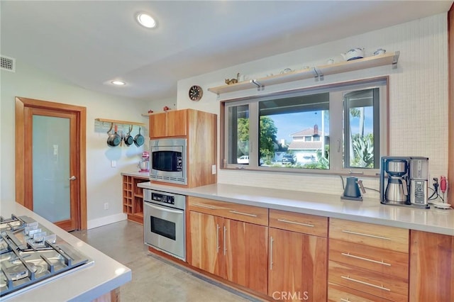3163 Inclinado, San Clemente, CA 92673 - kitchen with appliances with stainless steel finishes, tasteful backsplash, light countertops, recessed lighting, and finished concrete flooring