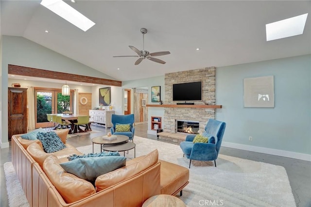 3163 Inclinado, San Clemente, CA 92673 - living room featuring a skylight, vaulted ceiling, a stone fireplace, recessed lighting, and ceiling fan
