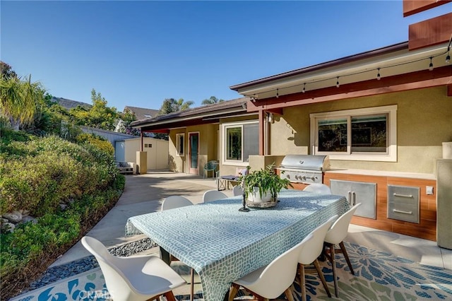 3163 Inclinado, San Clemente, CA 92673 - view of patio featuring outdoor dining space, an outdoor kitchen, and a shed