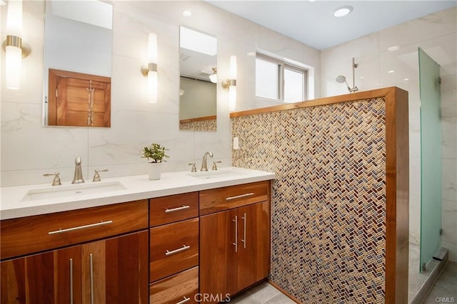 3163 Inclinado, San Clemente, CA 92673 - bathroom featuring tile walls, double vanity, a stall shower, and tasteful backsplash