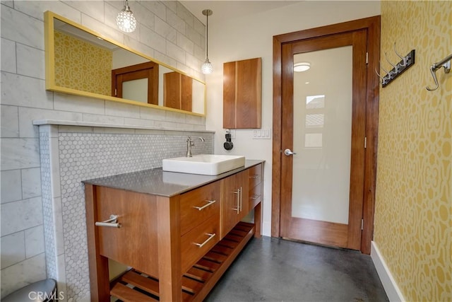 3163 Inclinado, San Clemente, CA 92673 - bathroom with vanity, concrete flooring, decorative backsplash, and wallpapered walls