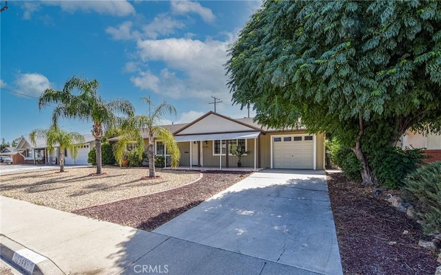 25981 Coombe Hill Dr, Menifee, CA 92586 - single story home featuring a garage, concrete driveway, and covered porch