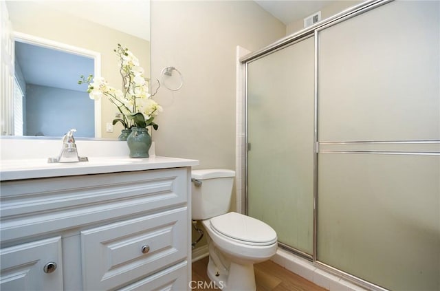25981 Coombe Hill Dr, Menifee, CA 92586 - bathroom with a shower with door, vanity, and wood finished floors