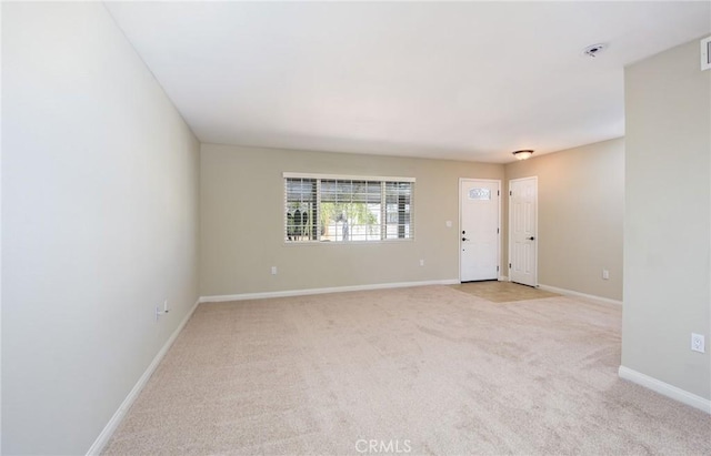 25981 Coombe Hill Dr, Menifee, CA 92586 - empty room featuring light colored carpet and fire sprinkler in ceiling