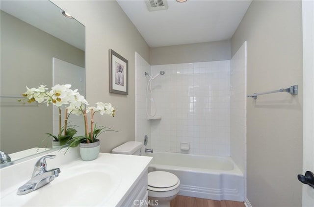 25981 Coombe Hill Dr, Menifee, CA 92586 - bathroom featuring vanity, bathtub / shower combination, and wood finished floors