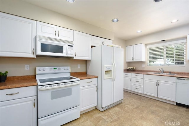 25981 Coombe Hill Dr, Menifee, CA 92586 - kitchen featuring white appliances, white cabinetry, and recessed lighting