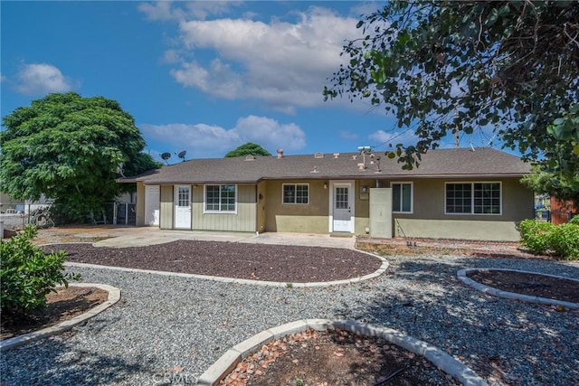 25981 Coombe Hill Dr, Menifee, CA 92586 - view of front facade with stucco siding and a patio area