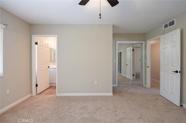 25981 Coombe Hill Dr, Menifee, CA 92586 - unfurnished bedroom featuring light colored carpet, connected bathroom, and ceiling fan