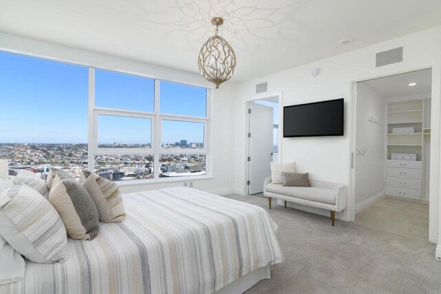 1325 Pacific Hwy Unit 3403, San Diego, CA 92101 - bedroom featuring a chandelier and light colored carpet