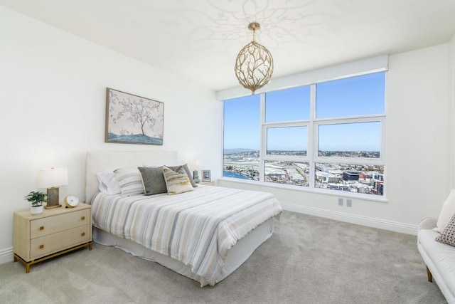 1325 Pacific Hwy Unit 3403, San Diego, CA 92101 - bedroom with light carpet and a chandelier