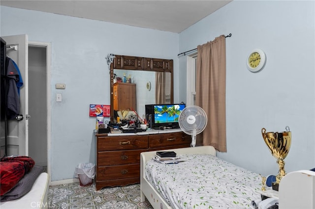 14057 Ohio St, Baldwin Park, CA 91706 - bedroom with baseboards and light tile patterned floors