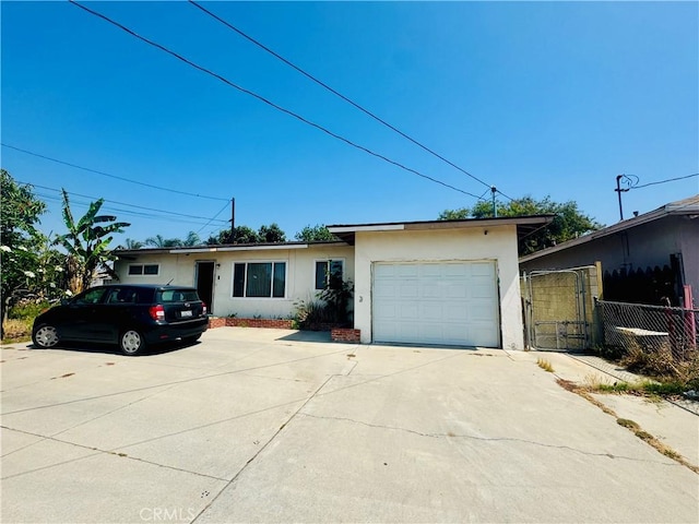 15130 Athol St, Fontana, CA 92335 - ranch-style home with stucco siding, driveway, and an attached garage