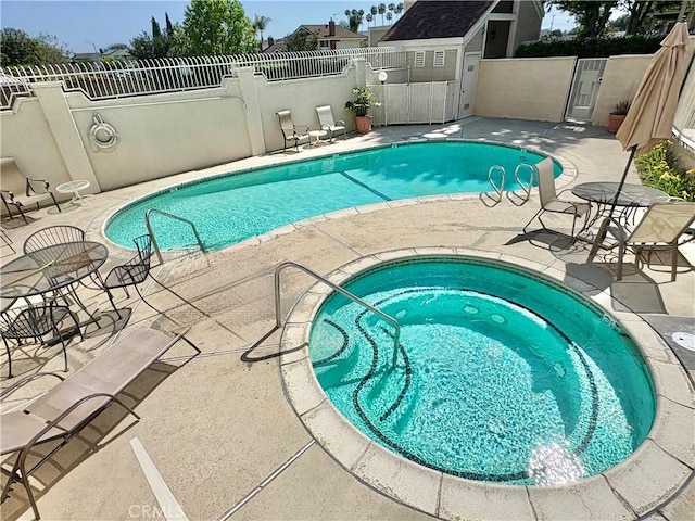 3845 Farquhar Ave Unit 212, Los Alamitos, CA 90720 - community pool featuring a patio and a community hot tub