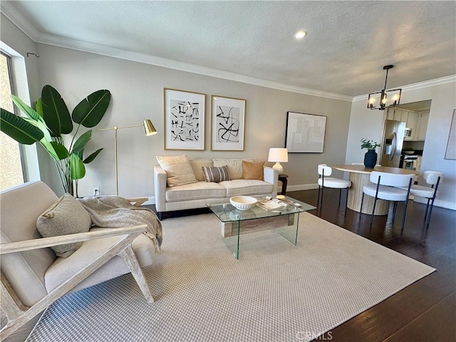 3845 Farquhar Ave Unit 212, Los Alamitos, CA 90720 - living room featuring crown molding, wood finished floors, a chandelier, and a textured ceiling