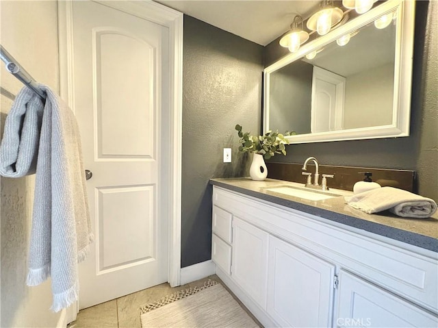 3845 Farquhar Ave Unit 212, Los Alamitos, CA 90720 - bathroom with vanity, tile patterned floors, and a textured wall