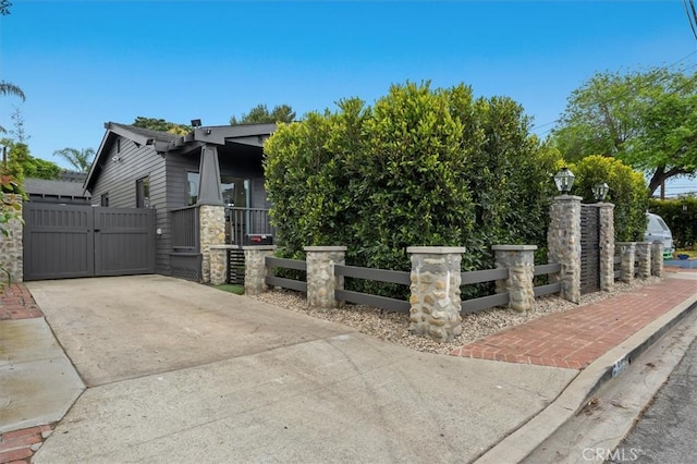 1012 10th St, Manhattan Beach, CA 90266 - view of front of house featuring a gate, a fenced front yard, and concrete driveway