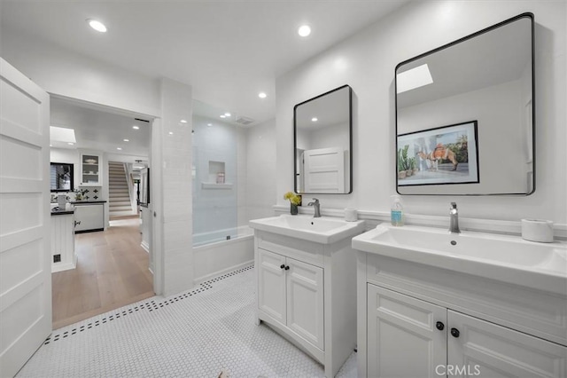 1012 10th St, Manhattan Beach, CA 90266 - full bath with two vanities, recessed lighting, and bathtub / shower combination