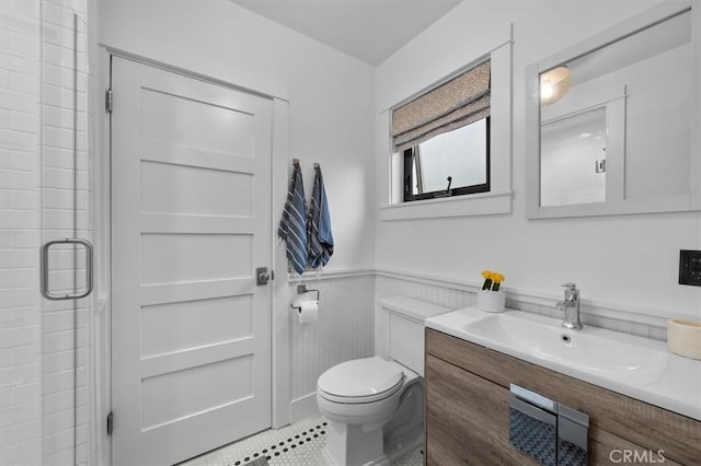 1012 10th St, Manhattan Beach, CA 90266 - full bath featuring vanity, a wainscoted wall, a stall shower, and tile patterned floors